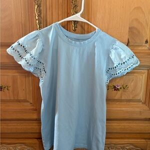 Girls’ light blue blouse, short sleeve